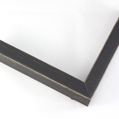 This simple, flat faced frame features rustic wood lightly coated in charcoal grey/black paint.  The top coat is rubbed away in places to reveal the natural wood color below, for a soft, antiqued look.

3/4 " wide: ideal for small and medium-size images.  Whether photography or paintings, rural scenes and simple images will look striking in this frame.