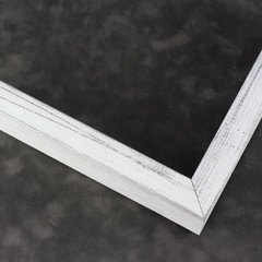 This simple, flat faced frame features rustic wood lightly coated in white paint.  The top coat is rubbed away in places to reveal the natural wood color below, for a soft, antiqued look.

3/4 " wide: ideal for small and medium-size images.  Whether photography or paintings, rural scenes and simple images will look striking in this frame.