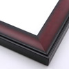 This solid wood frame has a shallow scoop profile and matte black edging.  The face features an ombre fade into and out of a rich mahogany with a faint wood-grain finish. 

2 " width: ideal for medium or large images.  This heavy frame is the perfect border for a bold watercolour or oil painting, or print.
